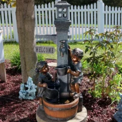 Sunnydaze Decor Sunnydaze 40"H Electric Polyresin Children Playing With Water Faucet Outdoor Water Fountain With LED Lights